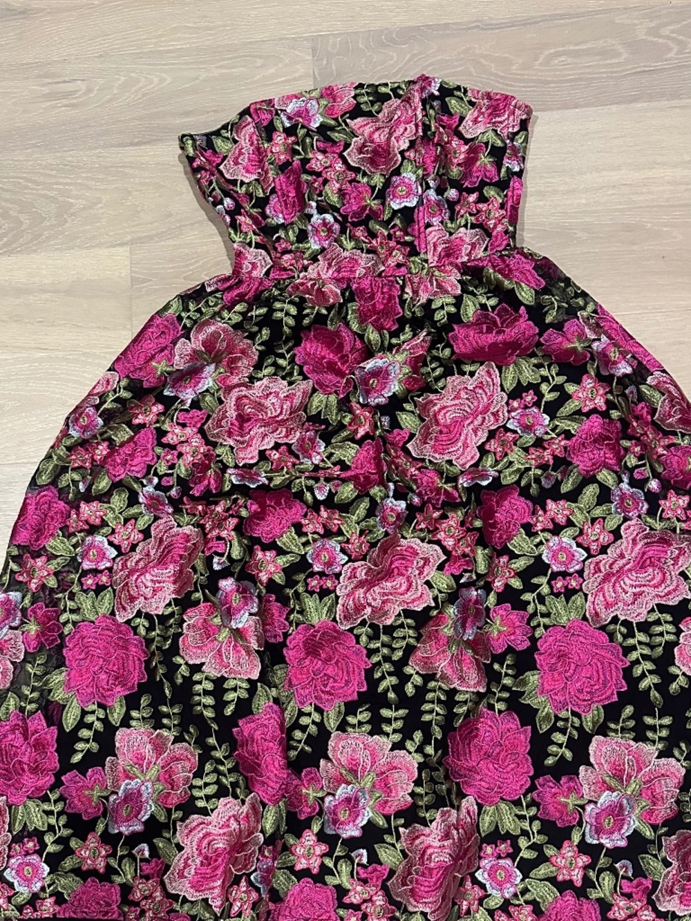 black strapless tie back midi dress with hot pink appliqué flowers